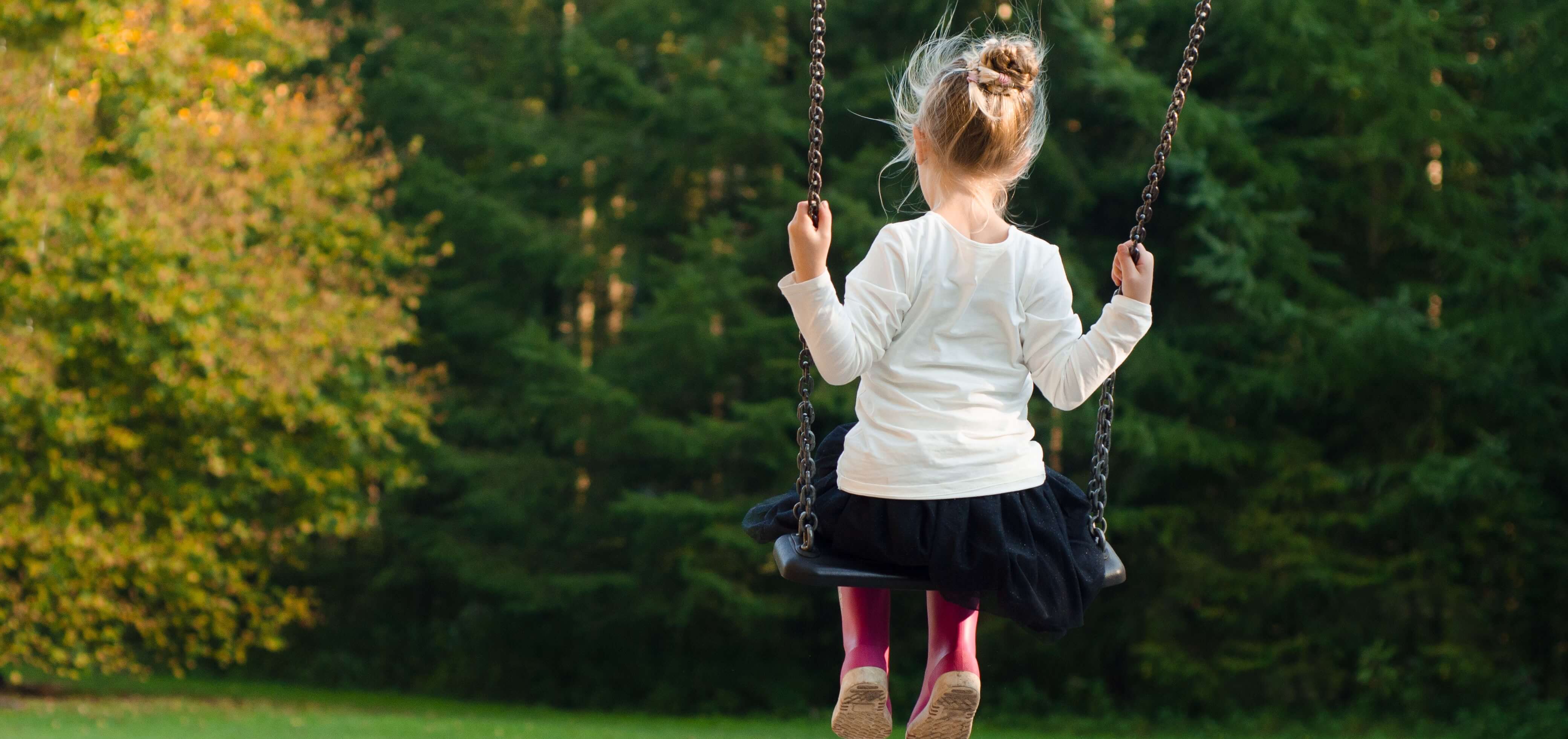 Girl on Swing - Playground Injuries