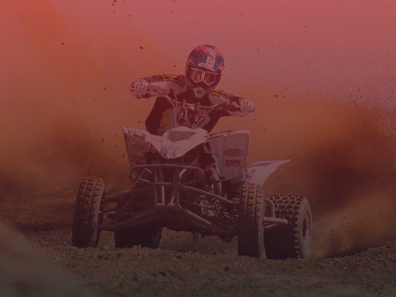 Man riding ATV in dirt